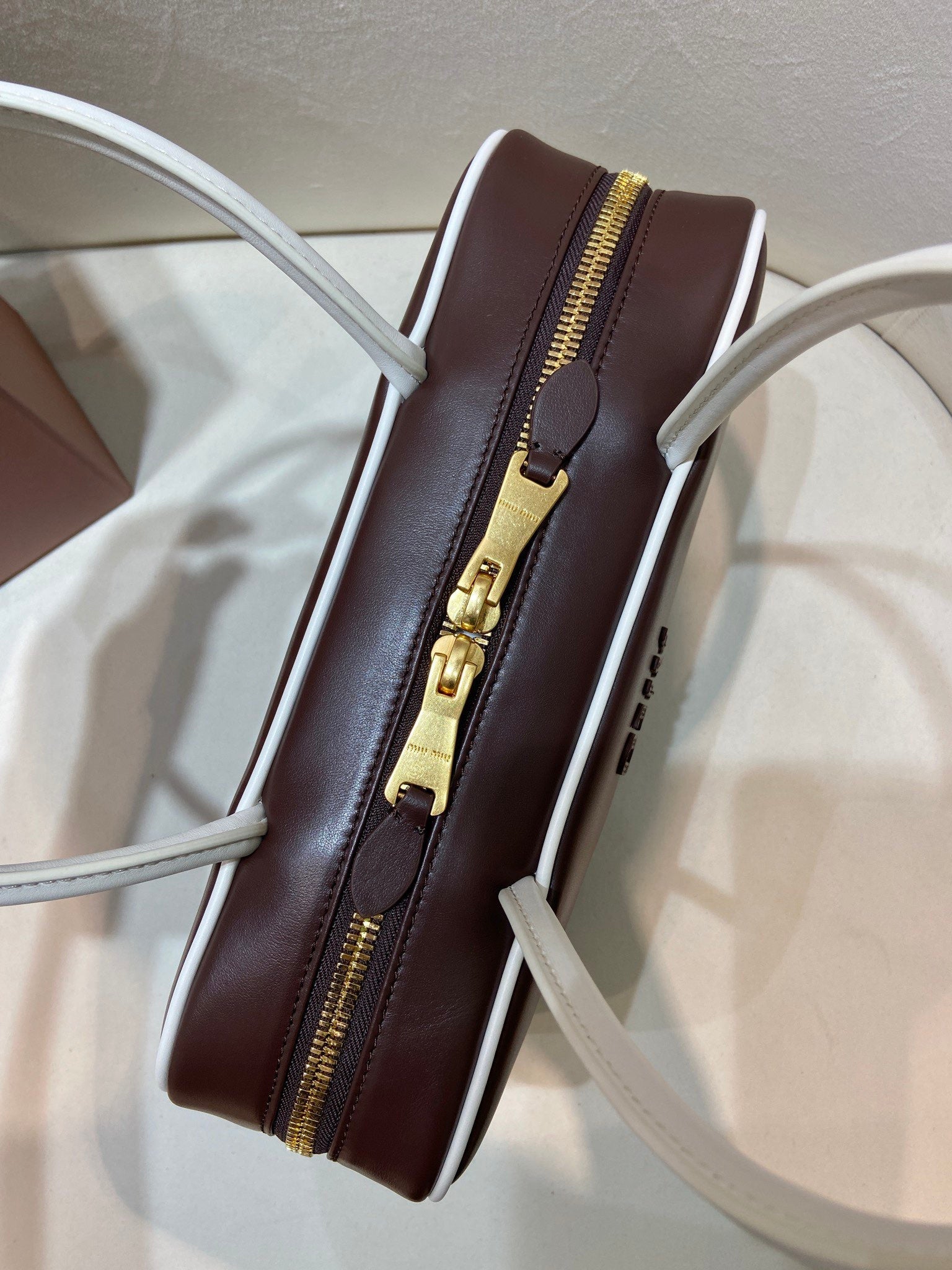 MIUMIU 26S BEAU BAG 30 IN DARK BROWN AND WHITE CALFSKIN
