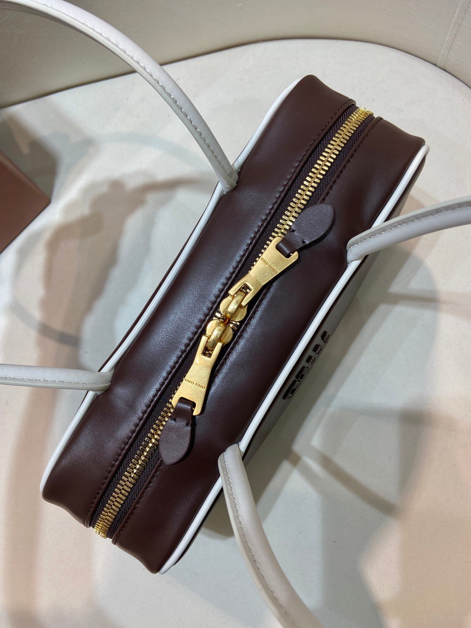 MIUMIU 26S BEAU BAG 28 IN DARK BROWN AND WHITE CALFSKIN