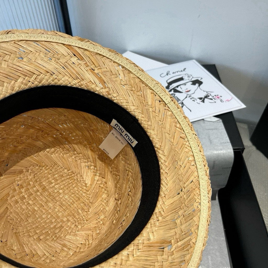 MIUMIU STRAW HAT IN BEIGE RAFFIA WITH BLACK FLOWER ACCENT