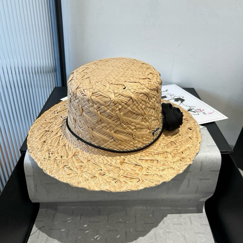 MIUMIU STRAW HAT IN BEIGE RAFFIA WITH BLACK FLOWER ACCENT