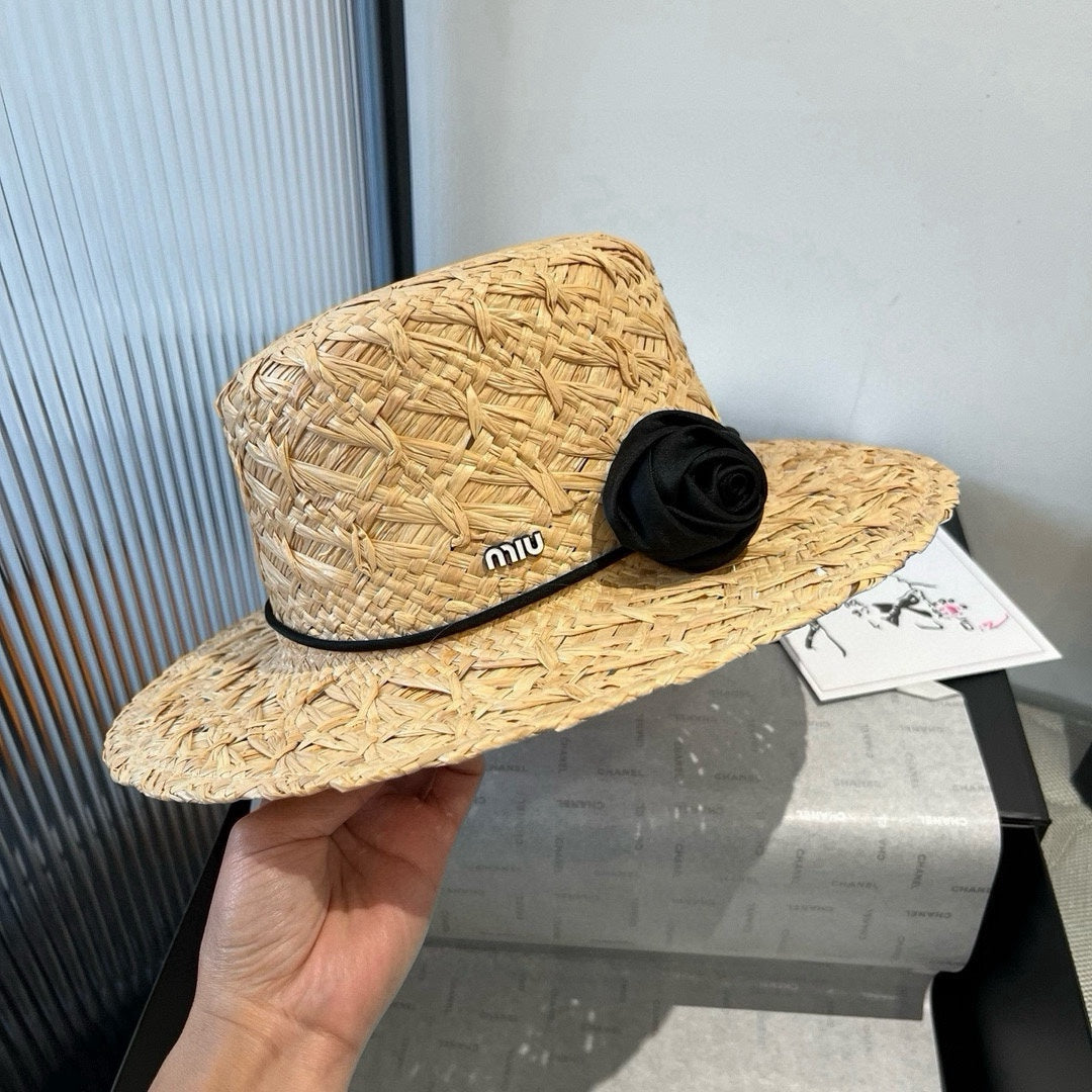MIUMIU STRAW HAT IN BEIGE RAFFIA WITH BLACK FLOWER ACCENT