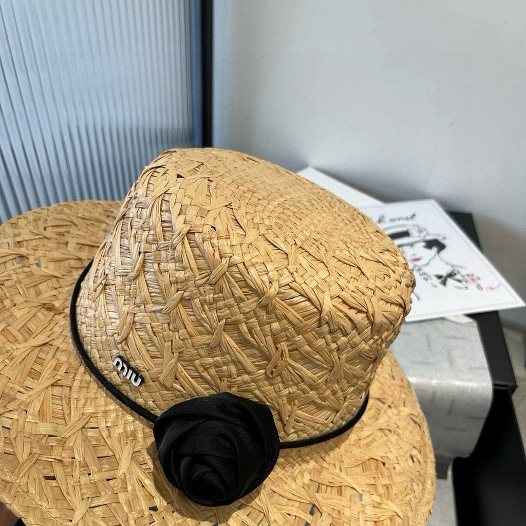 MIUMIU STRAW HAT IN BEIGE RAFFIA WITH BLACK FLOWER ACCENT