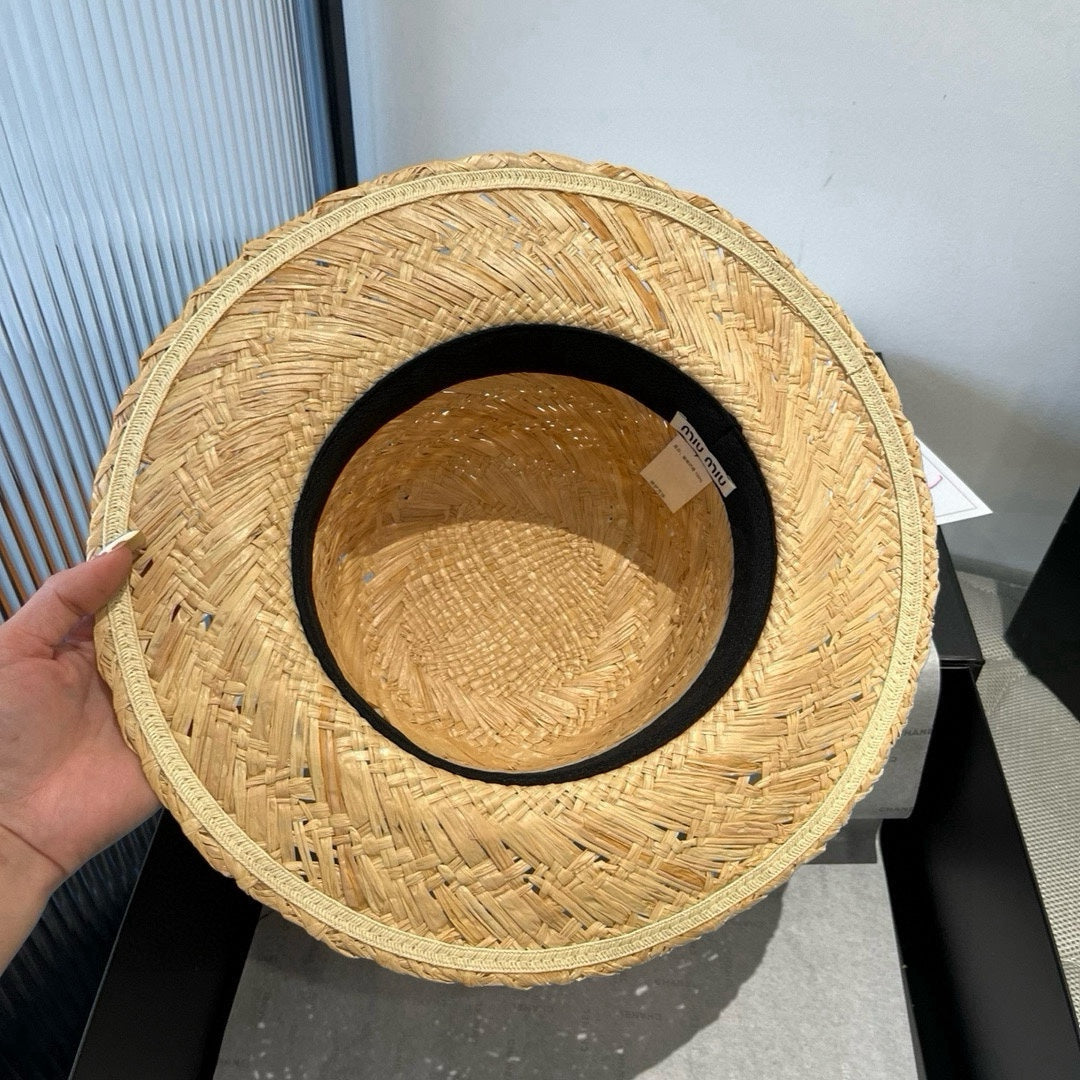 MIUMIU STRAW HAT IN BEIGE RAFFIA WITH BLACK FLOWER ACCENT