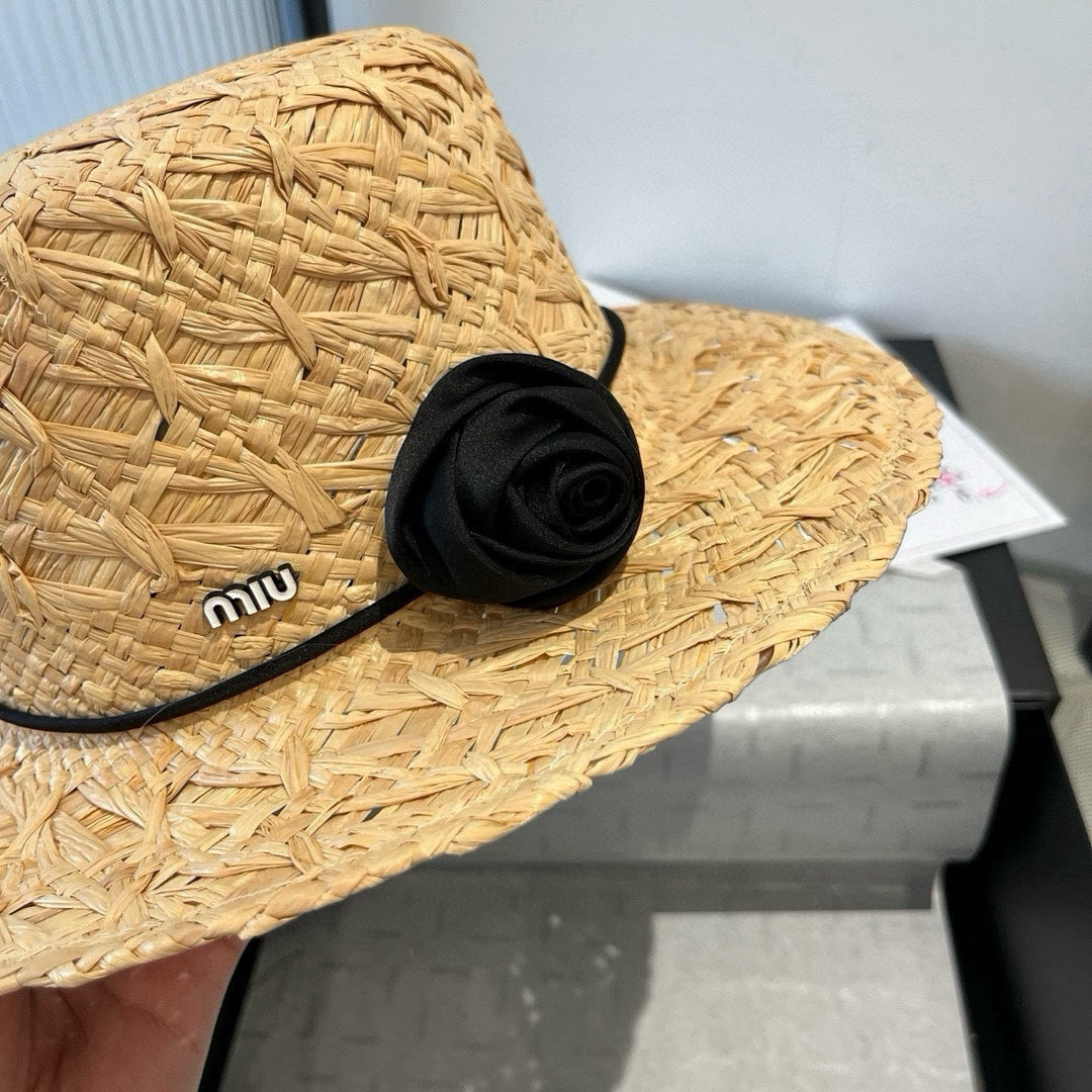MIUMIU STRAW HAT IN BEIGE RAFFIA WITH BLACK FLOWER ACCENT