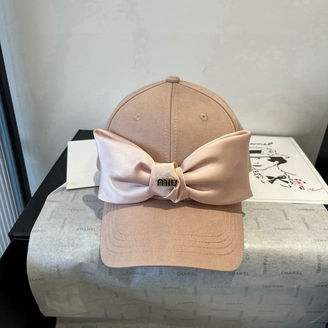 MIUMIU BASEBALL CAP IN BEIGE FABRIC WITH LARGE PINK BOW