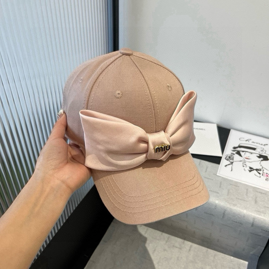 MIUMIU BASEBALL CAP IN BEIGE FABRIC WITH LARGE PINK BOW
