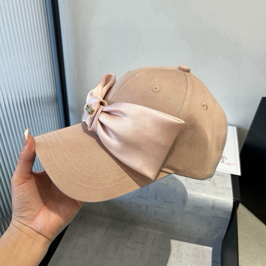 MIUMIU BASEBALL CAP IN BEIGE FABRIC WITH LARGE PINK BOW