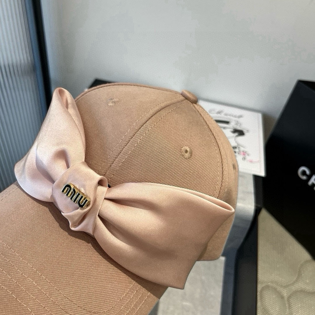MIUMIU BASEBALL CAP IN BEIGE FABRIC WITH LARGE PINK BOW