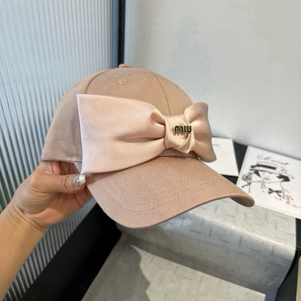 MIUMIU BASEBALL CAP IN BEIGE FABRIC WITH LARGE PINK BOW