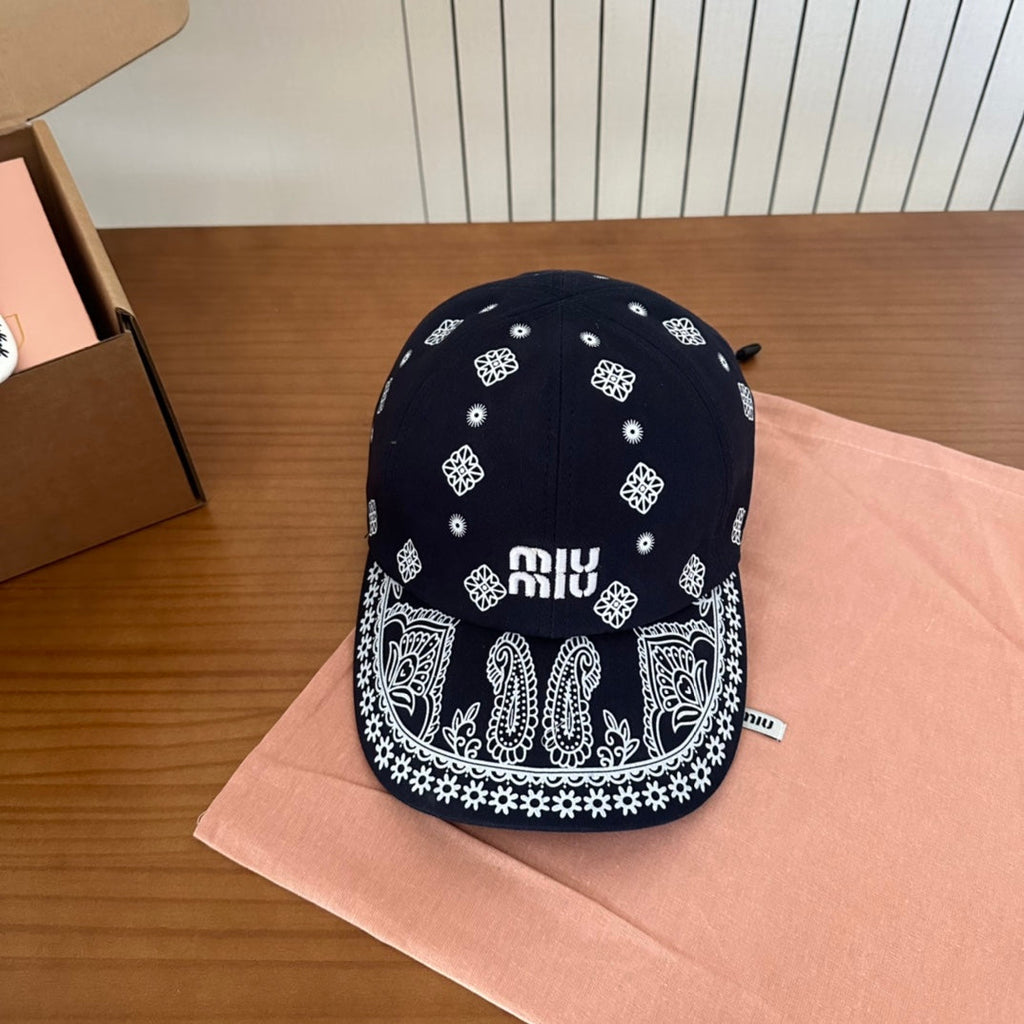 MIUMIU BASEBALL CAP IN BLACK WITH WHITE EMBROIDERED PATTERN