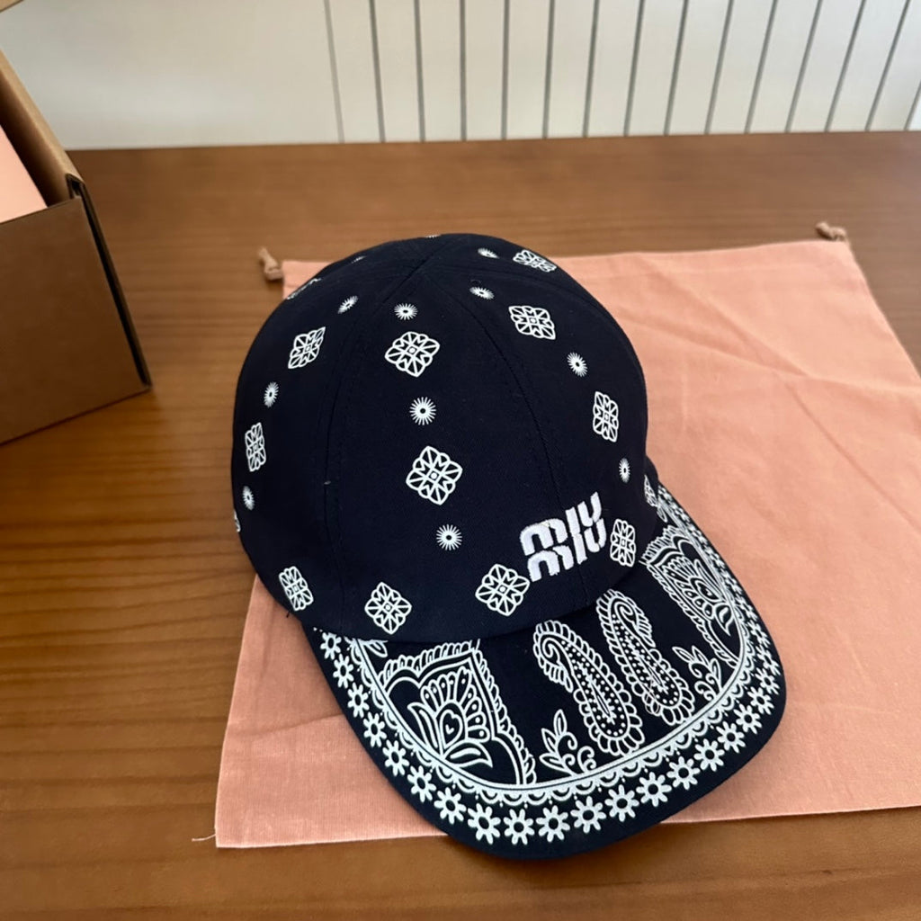 MIUMIU BASEBALL CAP IN BLACK WITH WHITE EMBROIDERED PATTERN