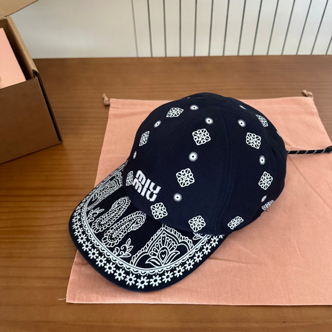 MIUMIU BASEBALL CAP IN BLACK WITH WHITE EMBROIDERED PATTERN