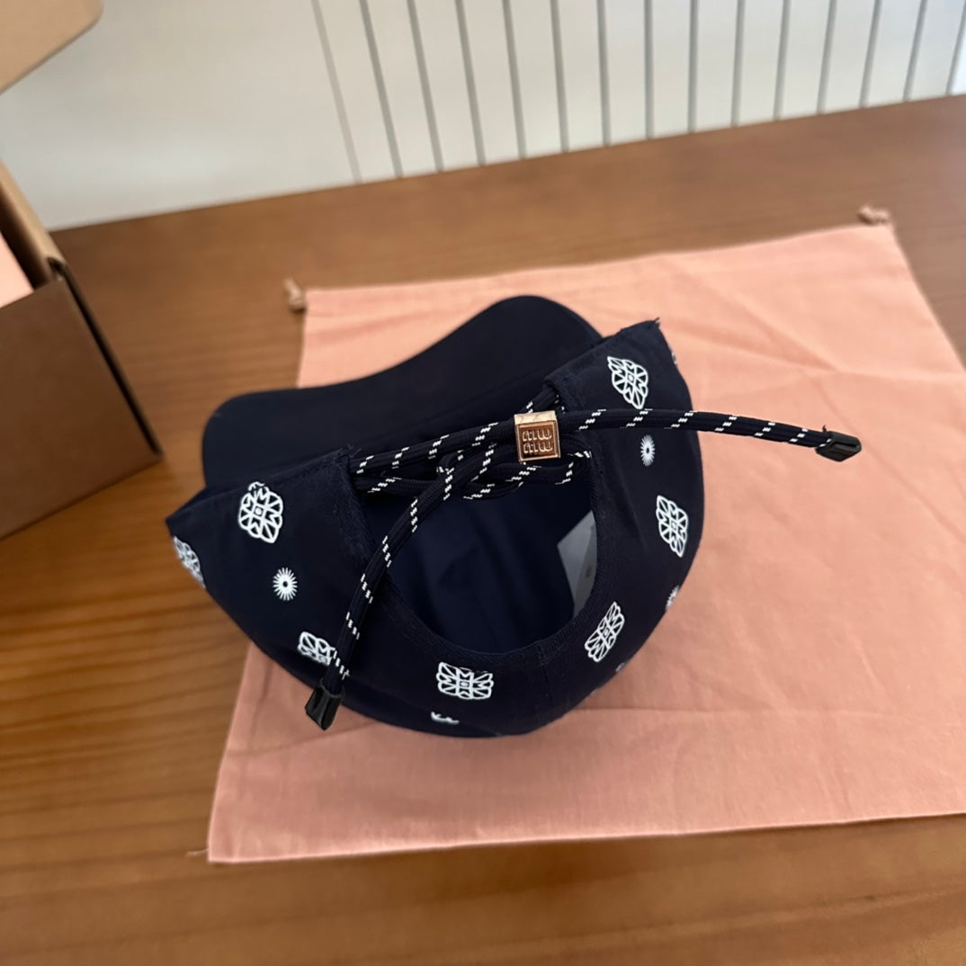 MIUMIU BASEBALL CAP IN BLACK WITH WHITE EMBROIDERED PATTERN