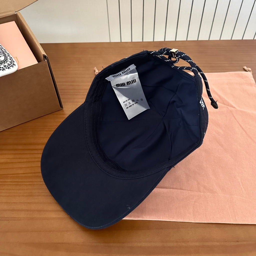 MIUMIU BASEBALL CAP IN BLACK WITH WHITE EMBROIDERED PATTERN