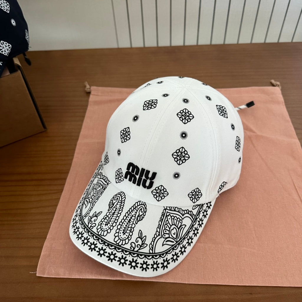 MIUMIU BASEBALL CAP IN WHITE WITH BLACK EMBROIDERED PATTERN