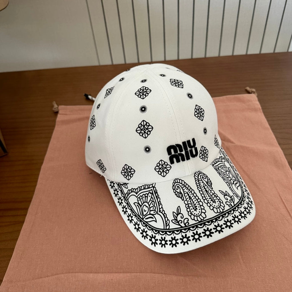 MIUMIU BASEBALL CAP IN WHITE WITH BLACK EMBROIDERED PATTERN