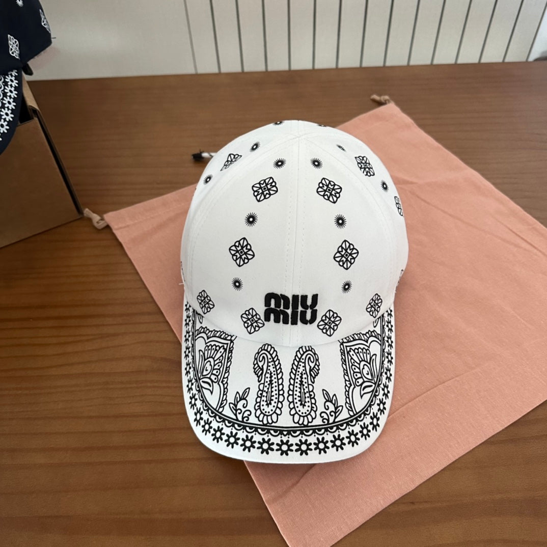MIUMIU BASEBALL CAP IN WHITE WITH BLACK EMBROIDERED PATTERN