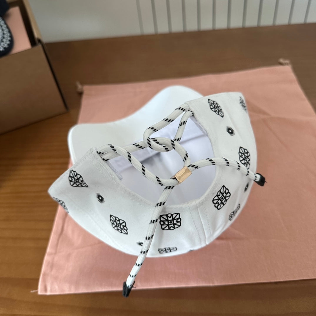 MIUMIU BASEBALL CAP IN WHITE WITH BLACK EMBROIDERED PATTERN