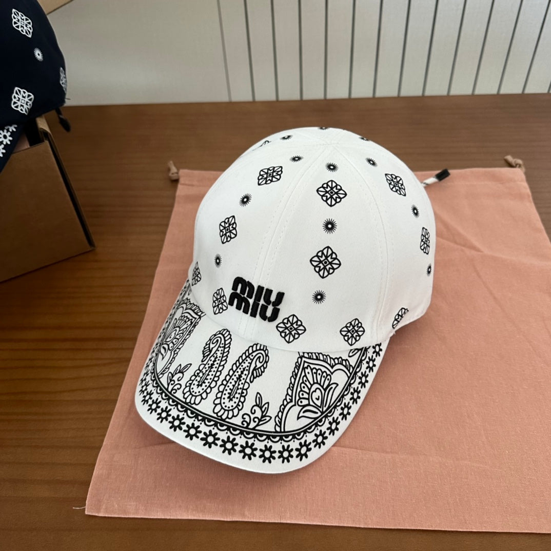 MIUMIU BASEBALL CAP IN WHITE WITH BLACK EMBROIDERED PATTERN