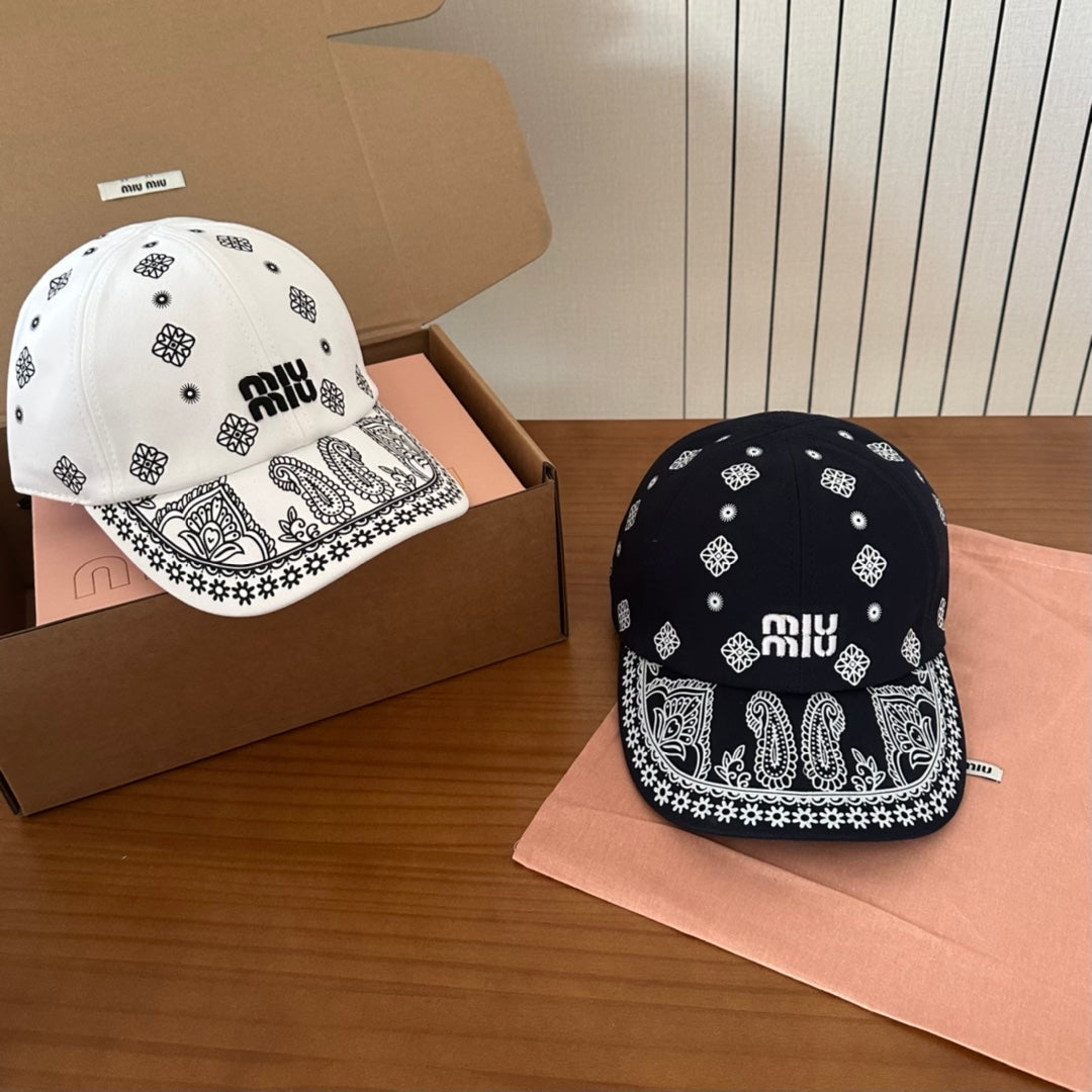 MIUMIU BASEBALL CAP IN WHITE WITH BLACK EMBROIDERED PATTERN