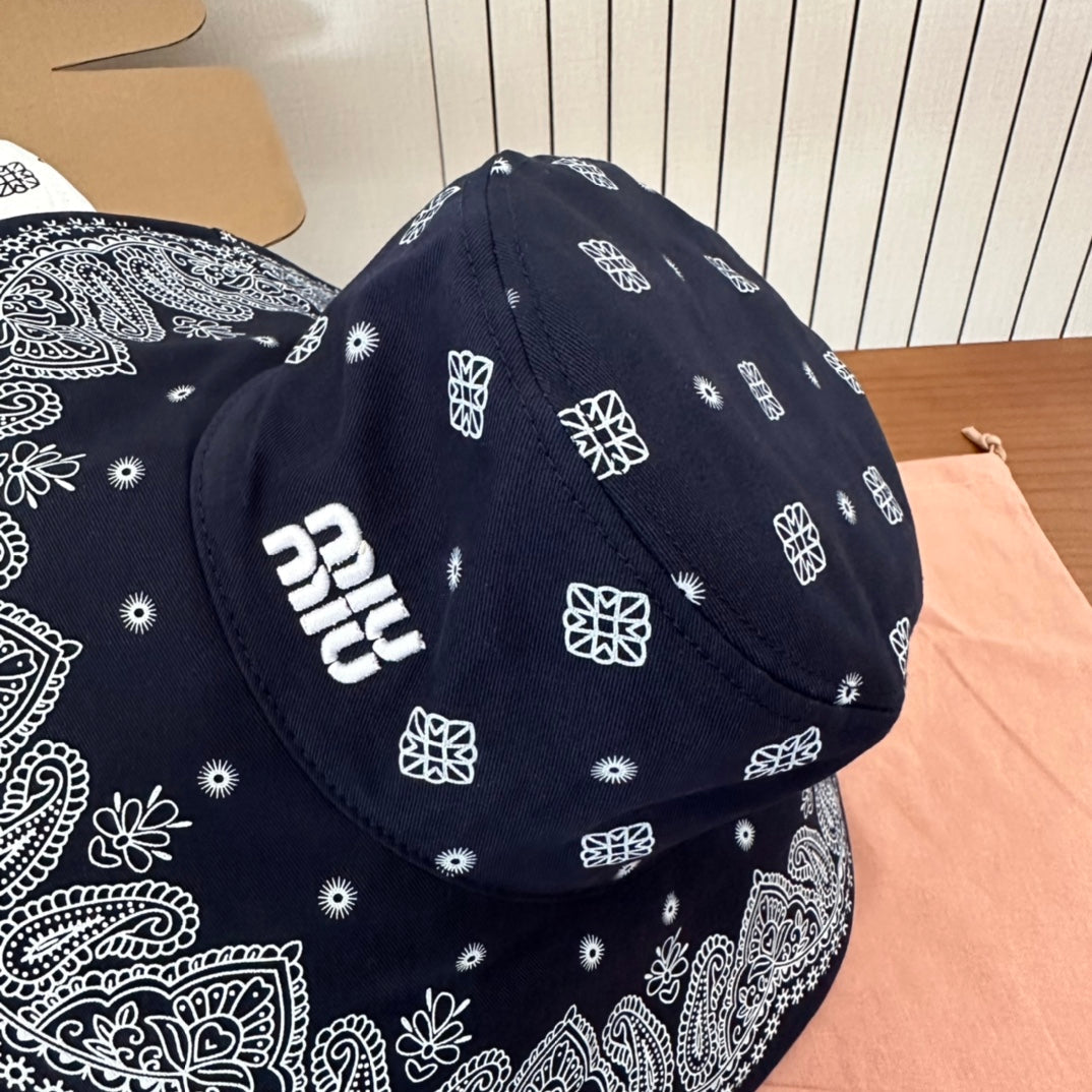 MIUMIU BUCKET IN BLACK FABRIC WITH EMBROIDERED PATTERN