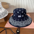 MIUMIU BUCKET IN BLACK FABRIC WITH EMBROIDERED PATTERN