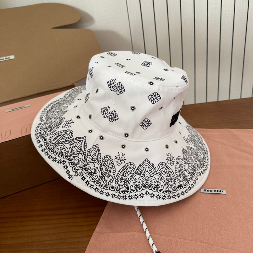 MIUMIU BUCKET IN WHITE FABRIC WITH BLACK EMBROIDERED PATTERN