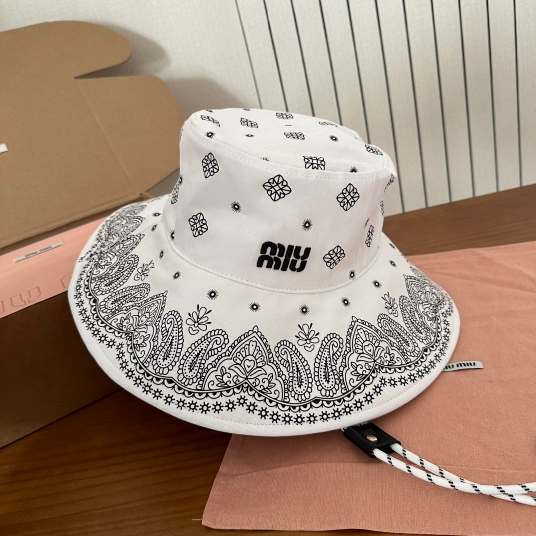 MIUMIU BUCKET IN WHITE FABRIC WITH BLACK EMBROIDERED PATTERN