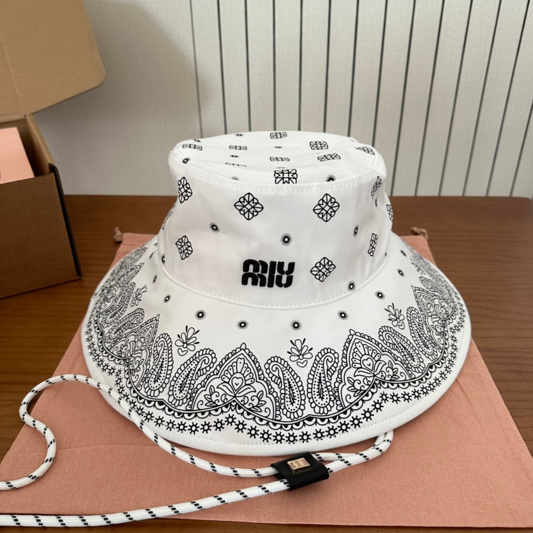 MIUMIU BUCKET IN WHITE FABRIC WITH BLACK EMBROIDERED PATTERN