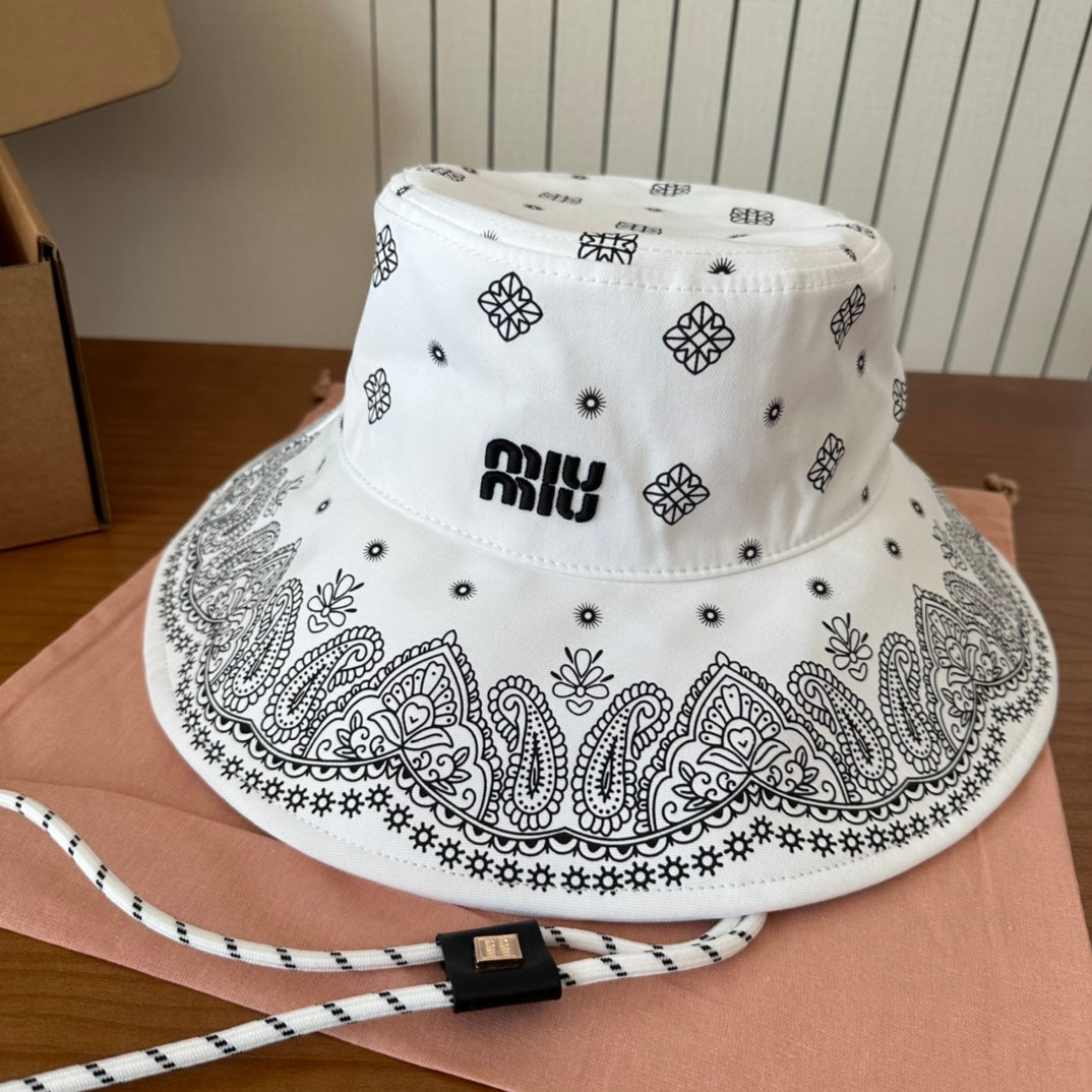 MIUMIU BUCKET IN WHITE FABRIC WITH BLACK EMBROIDERED PATTERN