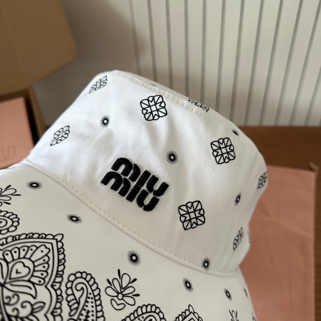 MIUMIU BUCKET IN WHITE FABRIC WITH BLACK EMBROIDERED PATTERN
