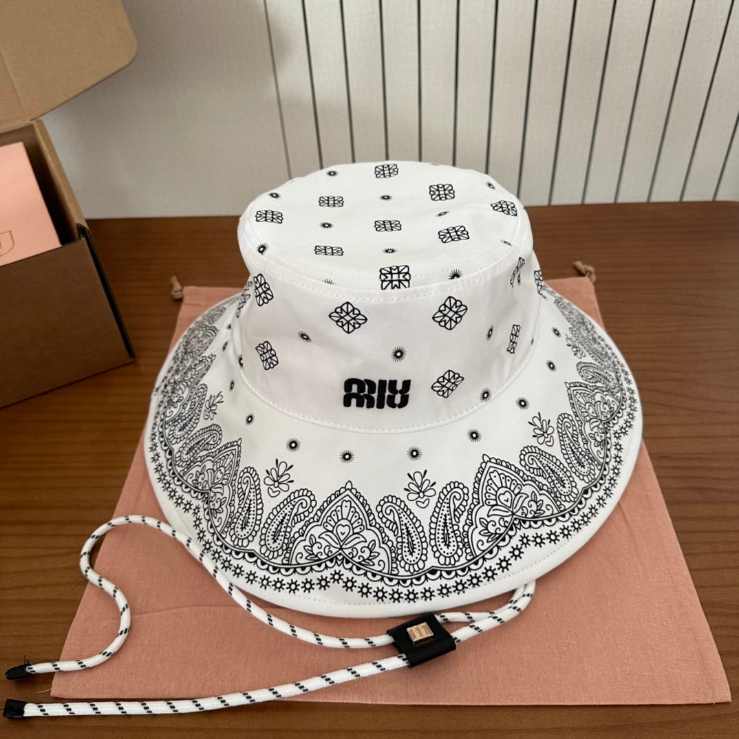 MIUMIU BUCKET IN WHITE FABRIC WITH BLACK EMBROIDERED PATTERN