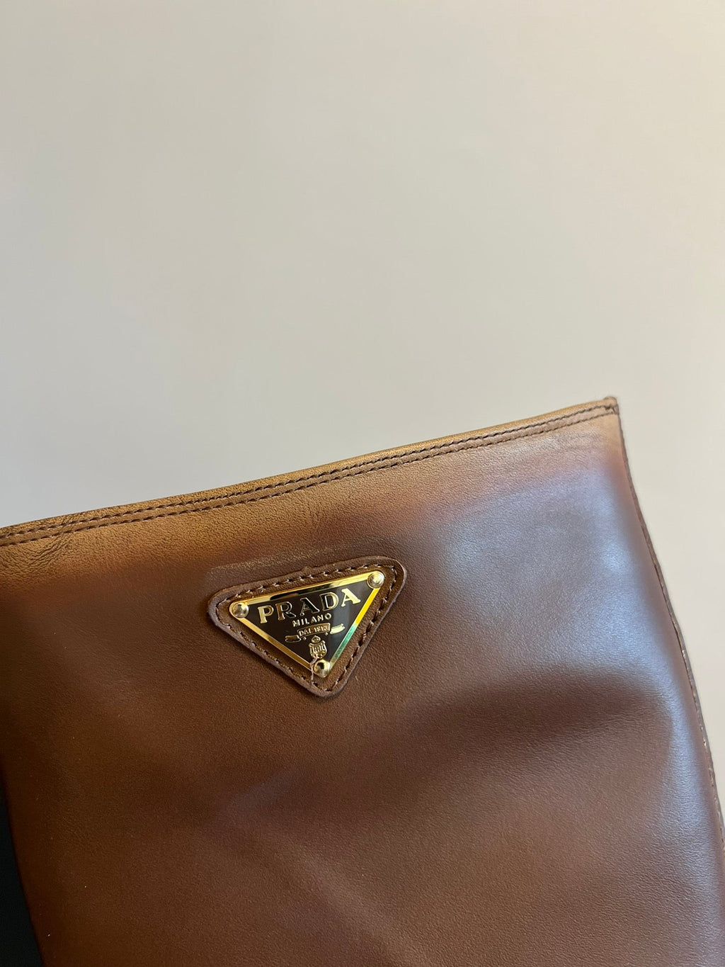 PRADA 25S HIGH-CUT PLATFORM BOOTS IN BROWN CALFSKIN WITH GOLD HARDWARE