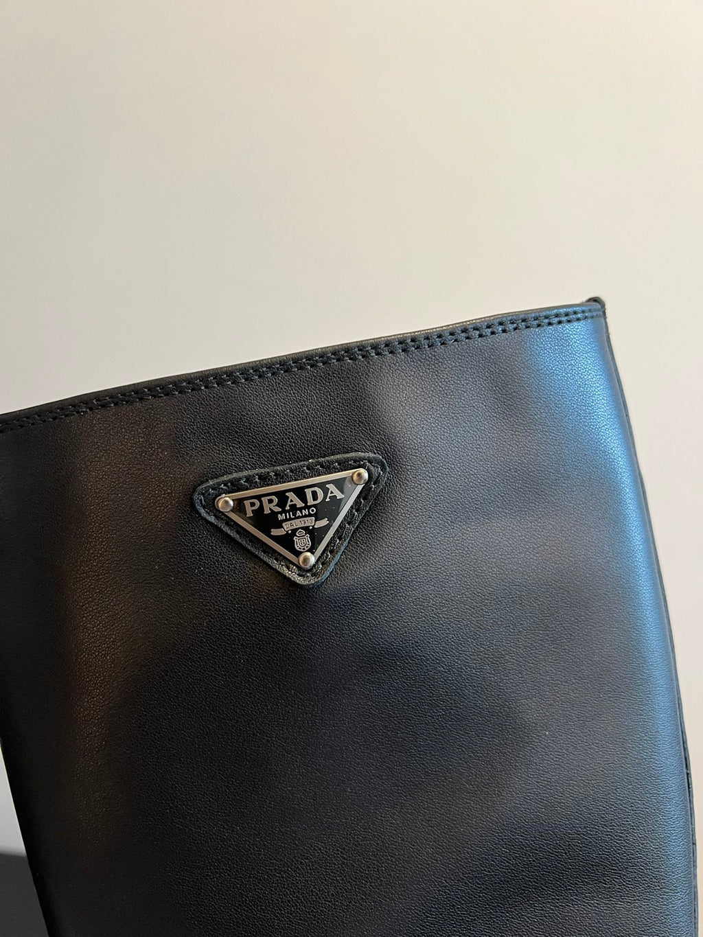 PRADA 25S HIGH-CUT PLATFORM BOOTS IN BLACK CALFSKIN WITH SILVER HARDWARE