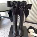 CHANEL BOW HIGH BOOTS IN BLACK CALFSKIN
