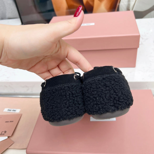 MIUMIU 26S BOAT LOAFERS IN BLACK SHEARLING