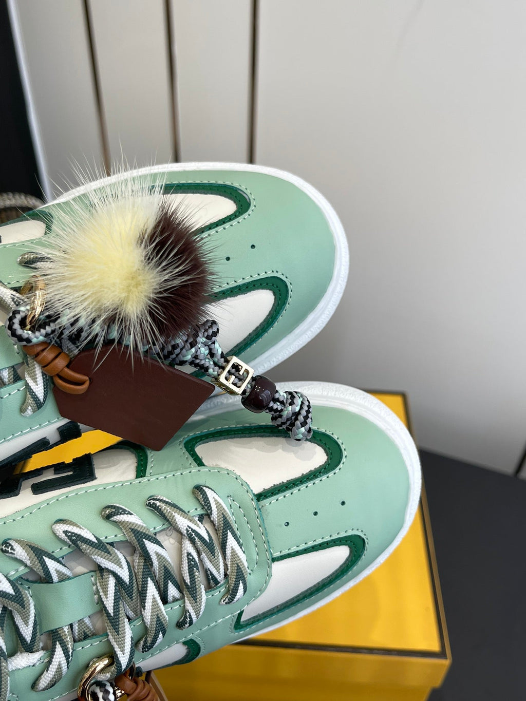 FENDI 25S SNEAKERS 50 MM IN SOFT SAGE GREEN SYNTHETIC LEATHER WITH CHARM
