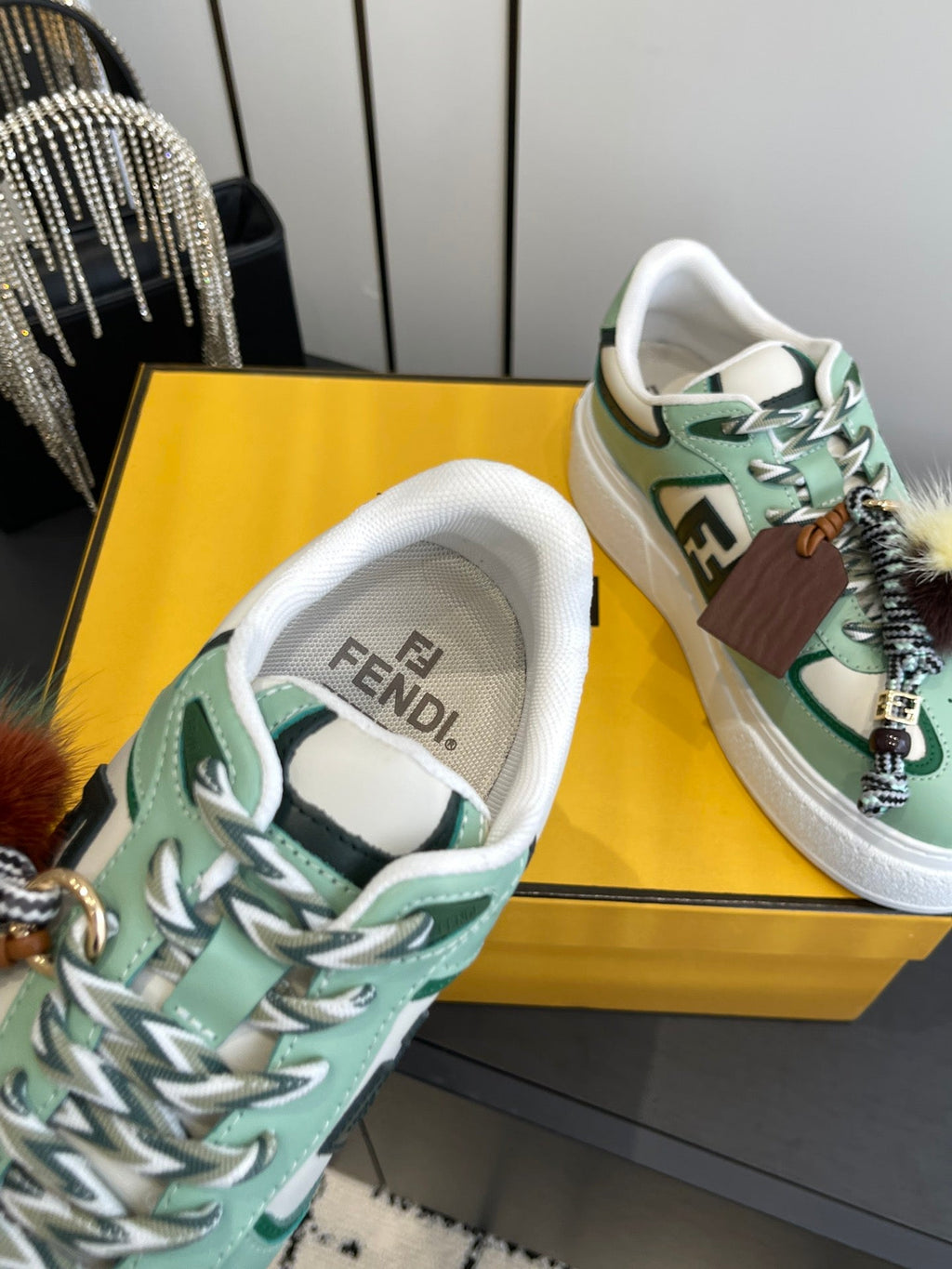 FENDI 25S SNEAKERS 50 MM IN SOFT SAGE GREEN SYNTHETIC LEATHER WITH CHARM