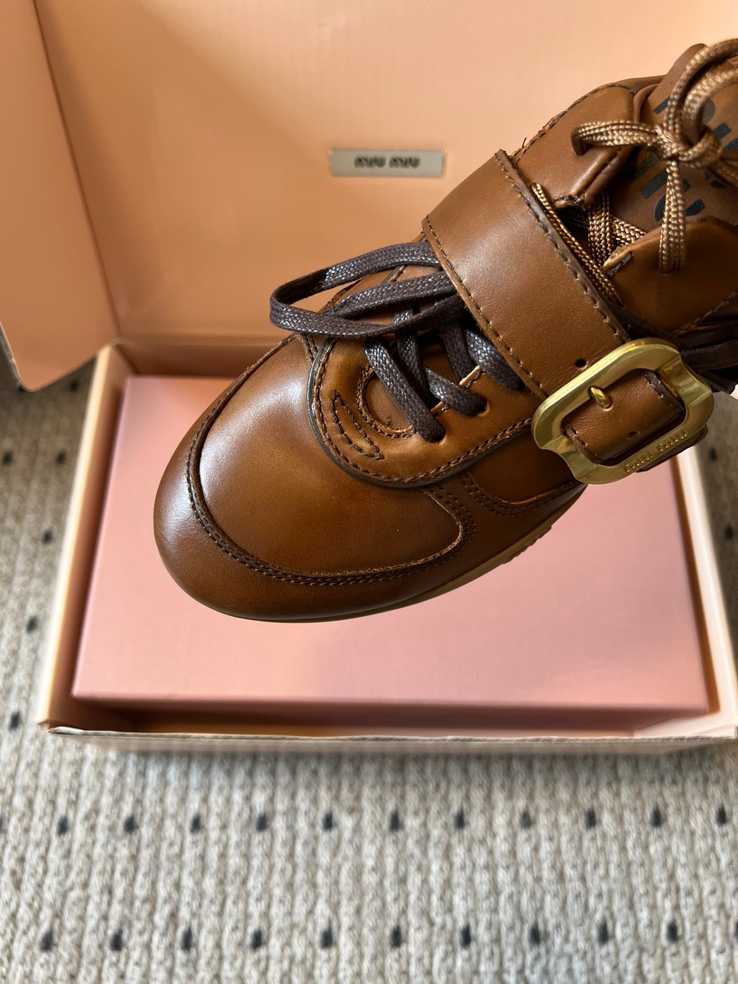 MIUMIU 26S GYMNASIUM SNEAKER IN COGNAC BROWN CALFSKIN WITH GOLD BUCKLED STRAP