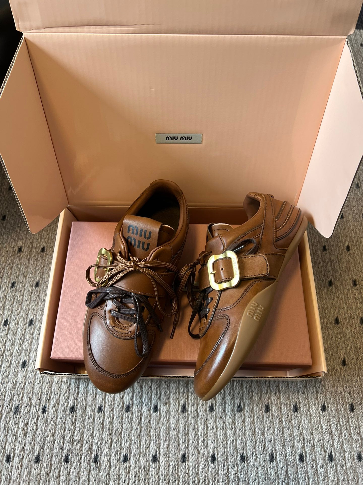 MIUMIU 26S GYMNASIUM SNEAKER IN COGNAC BROWN CALFSKIN WITH GOLD BUCKLED STRAP