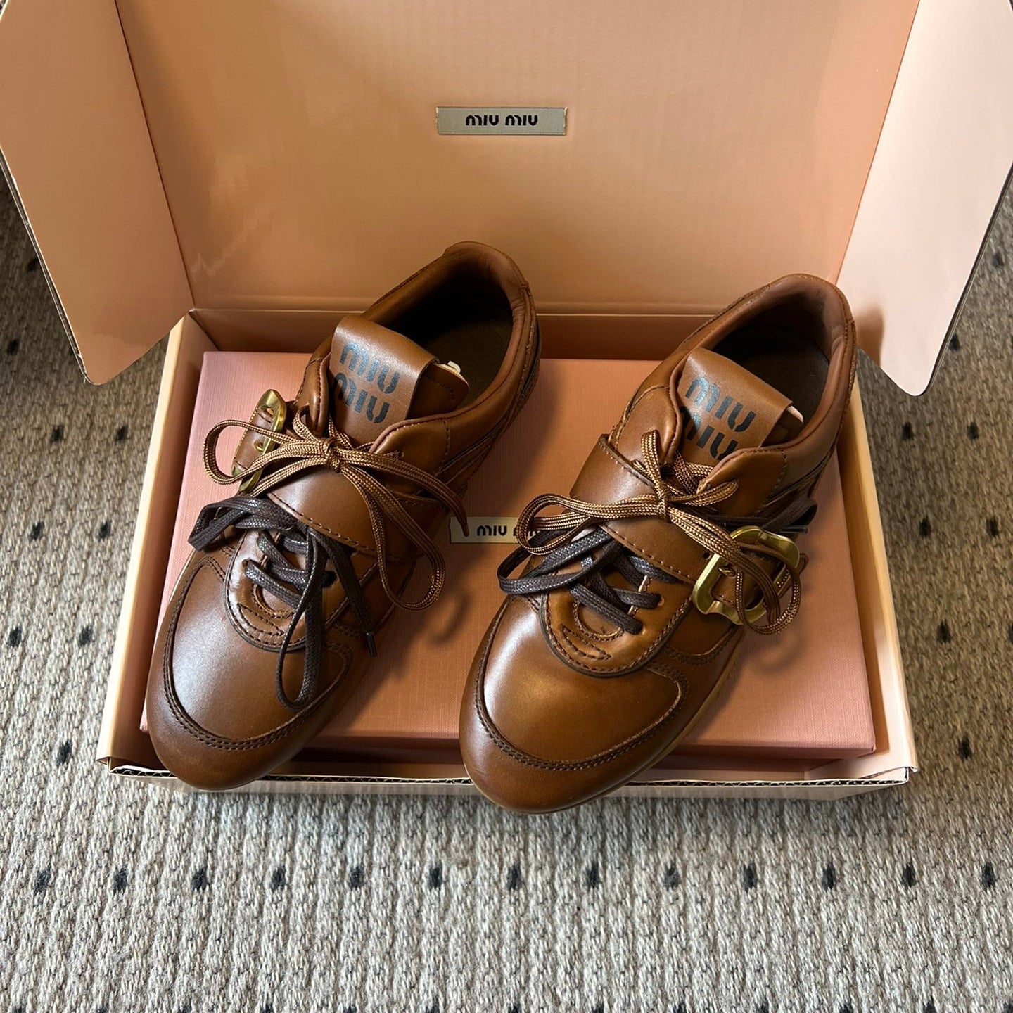 MIUMIU 26S GYMNASIUM SNEAKER IN COGNAC BROWN CALFSKIN WITH GOLD BUCKLED STRAP