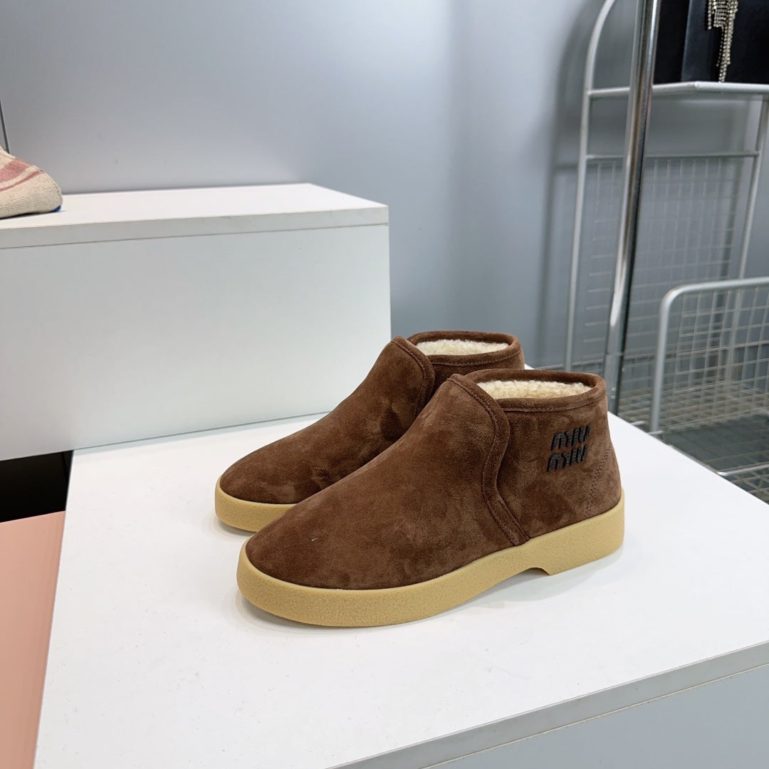 MIUMIU 25S SLIP-ON BOOTIES IN DARK BROWN SUEDE AND SHEARLING