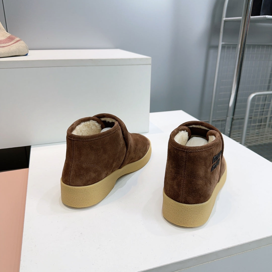 MIUMIU 25S SLIP-ON BOOTIES IN DARK BROWN SUEDE AND SHEARLING