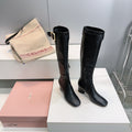 MIUMIU 25S BOOTS WITH BUCKLE 60MM IN BLACK CALFSKIN