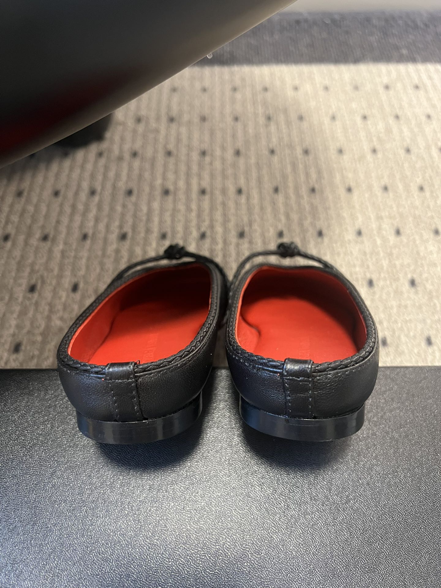 BOTTEGA VENETA 26S FLAT MULES IN BLACK LAMBSKIN