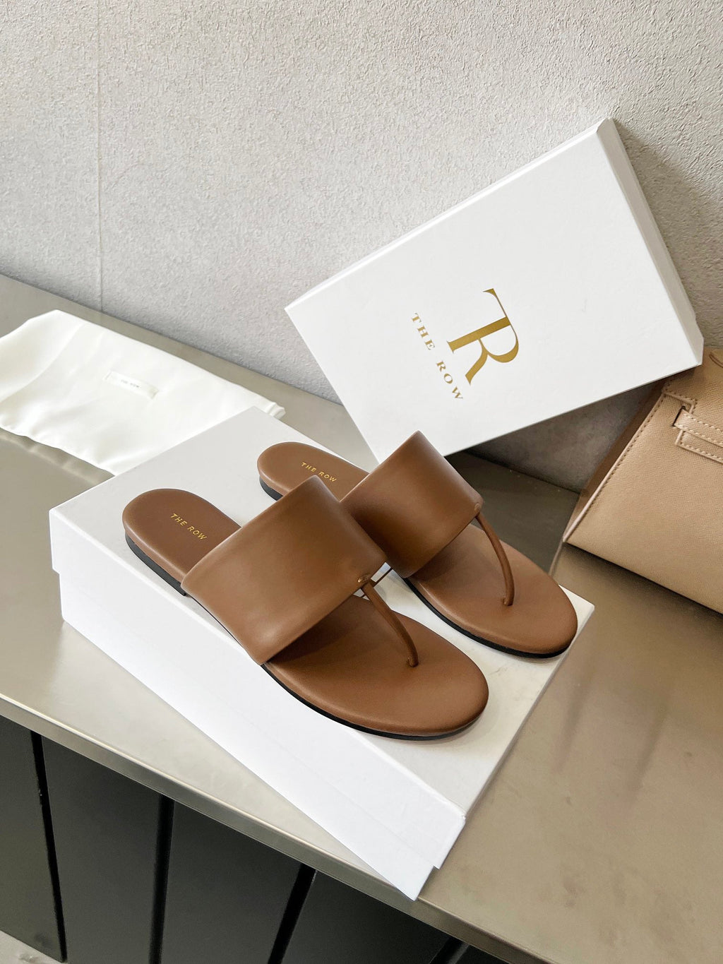 THE ROW 26S FLAT THONG SANDALS IN BROWN CALFSKIN