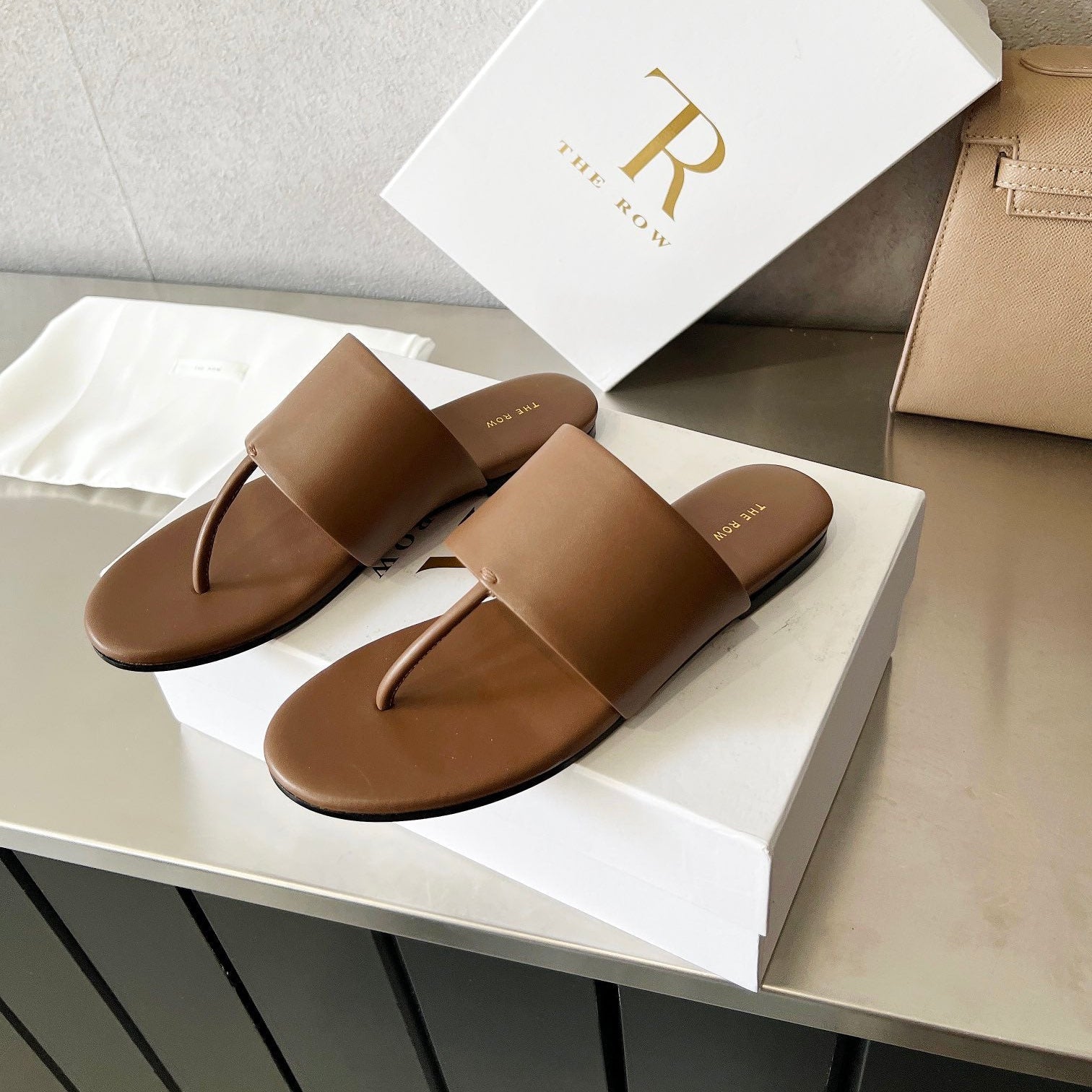 THE ROW 26S FLAT THONG SANDALS IN BROWN CALFSKIN