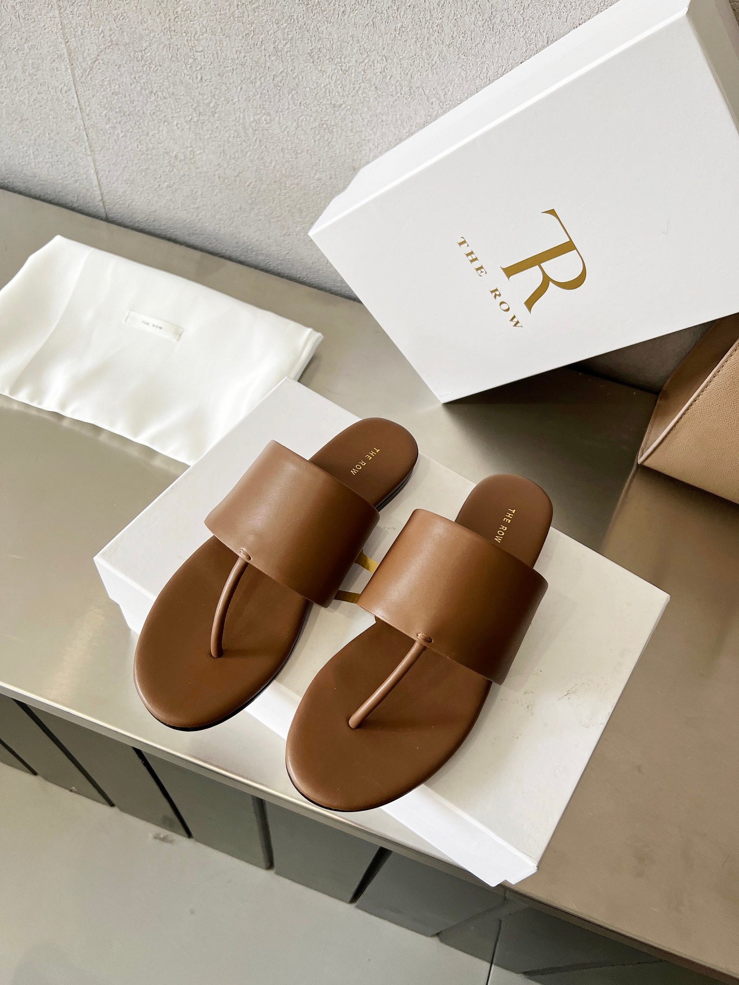 THE ROW 26S FLAT THONG SANDALS IN BROWN CALFSKIN