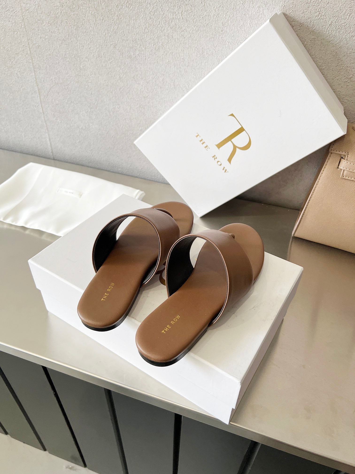 THE ROW 26S FLAT THONG SANDALS IN BROWN CALFSKIN