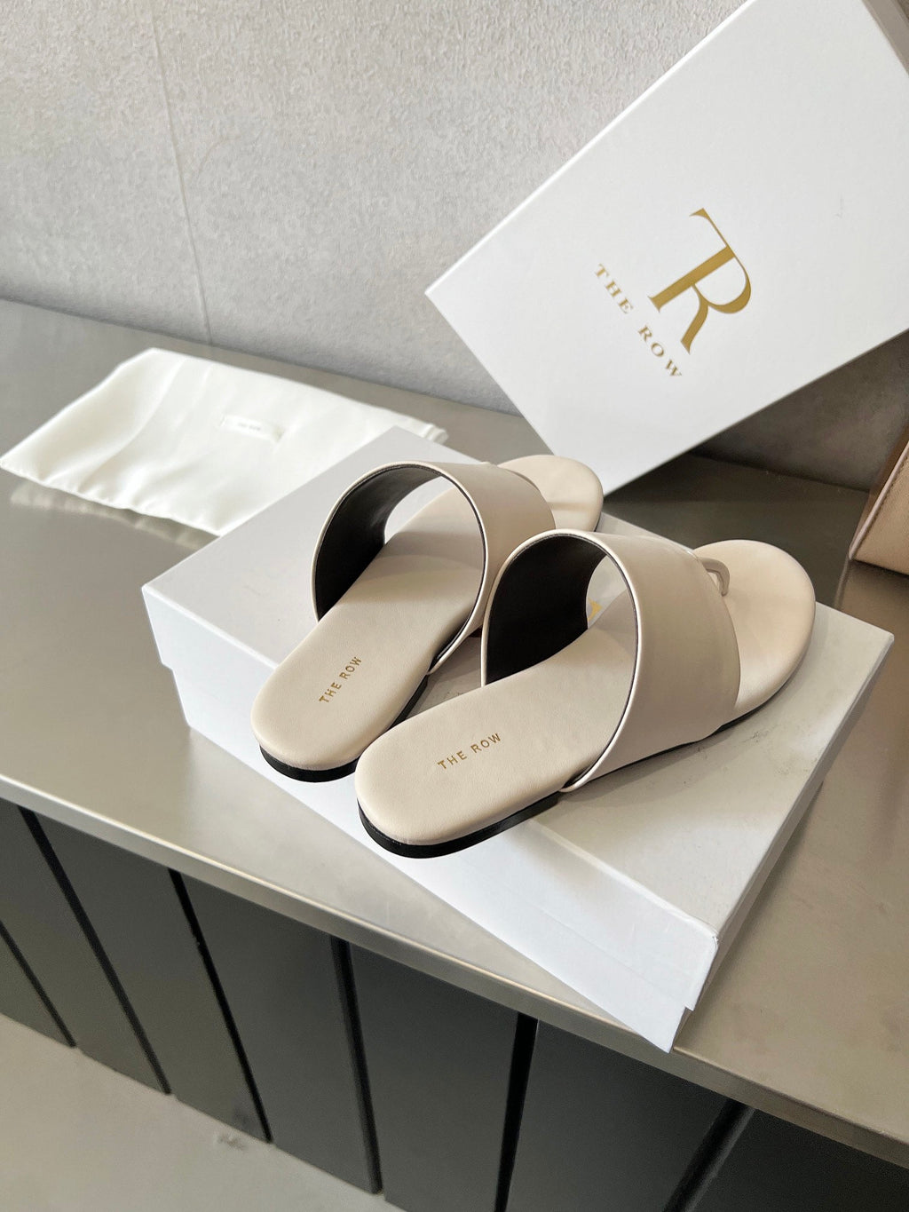THE ROW 26S FLAT THONG SANDALS IN WHITE CALFSKIN